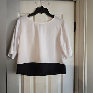 White and black blouse with cute triangle cut out in the back